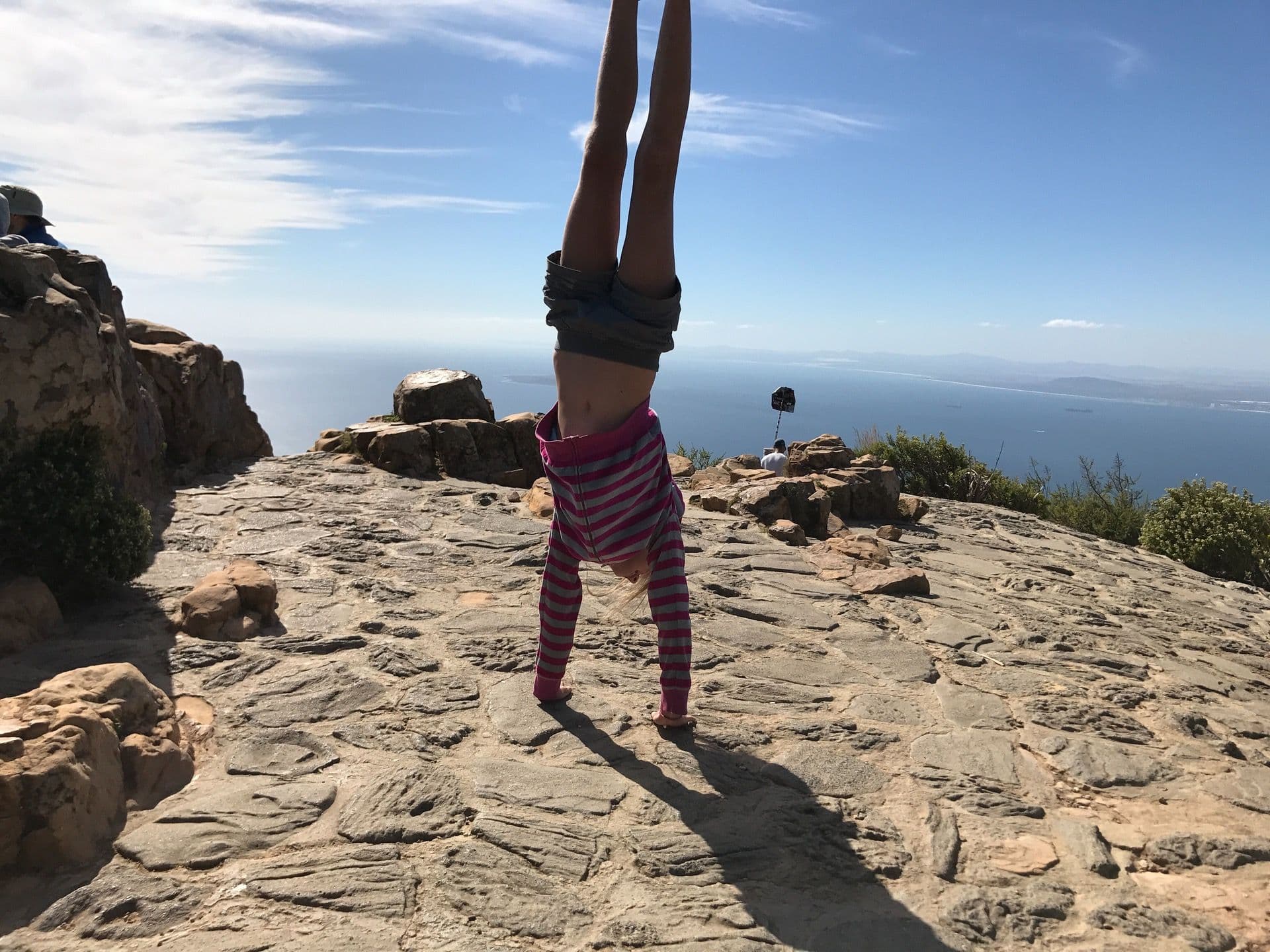 Always Upside Down - Kiara on top of Lion’s Head in Cape Town, 2018